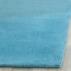 Mandy Solid Tufted Rug - Safavieh